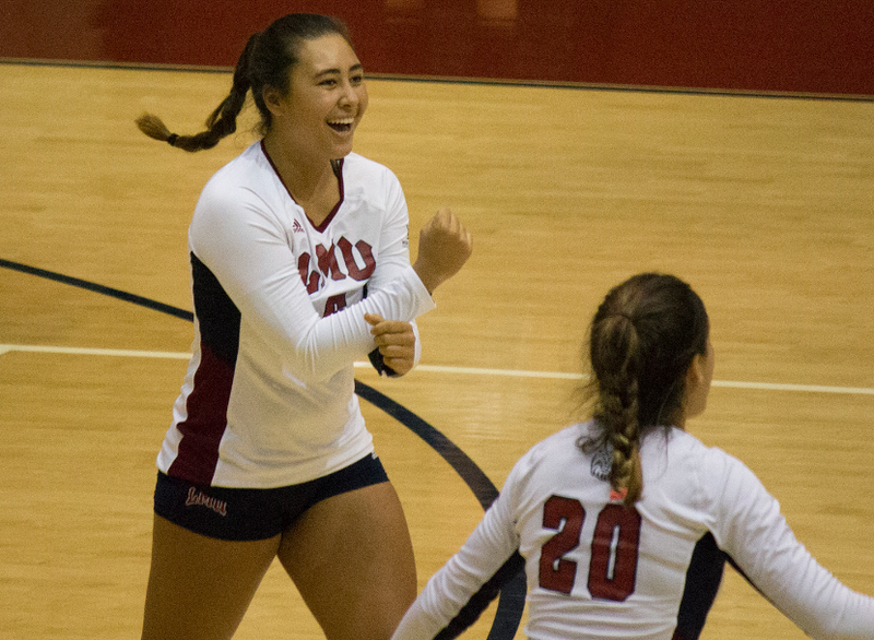 LMU’s Kekai Whitford exults after winning a point against Santa Clara Sept. 27 in the Lions’ straight-set win. Also pictured is the Lions’ Jessie Pritchard (20). (CREDIT: LOYOLA MARYMOUNT UNIVERSITY)