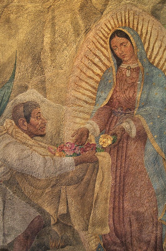 Painting of the Virgin Mary giving roses to Juan Diego on the chapel wall on Tepeyac Hill on December 12