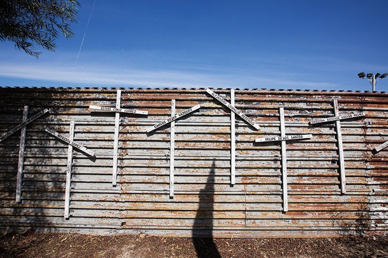 Crosses in Tijuana on Mexico-side of the fence dividing the United States and Mexico commemorated loved ones who have died crossing the border. (photo/VICTOR ALEMÁN)