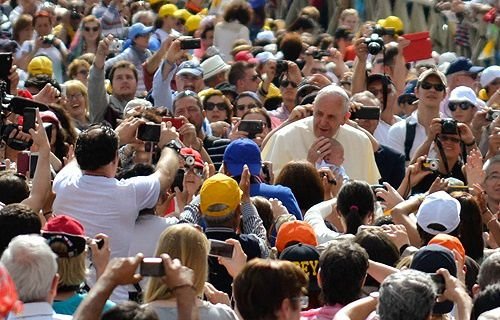 Pope Francis greets pilgrims in St. Peter's Square during the Wednesday general audience on May 28