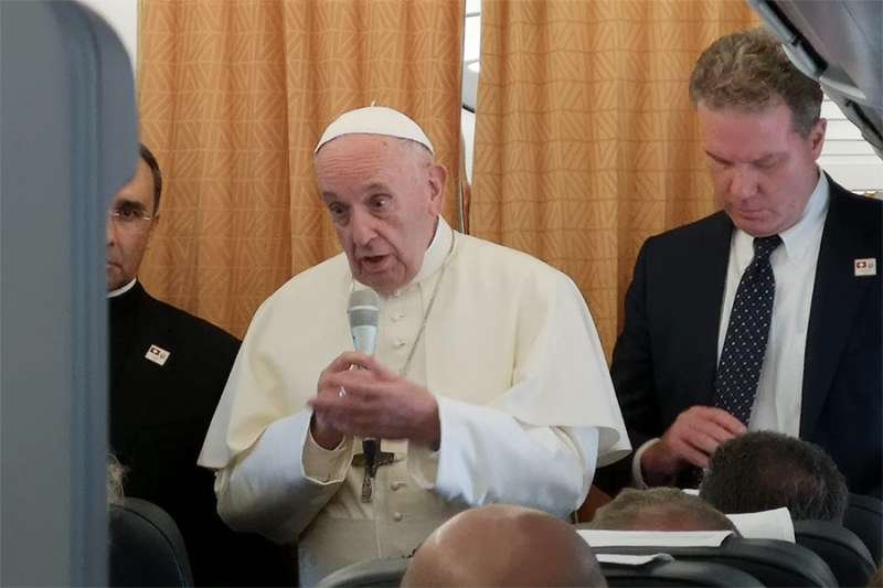 Pope Francis on the return flight from his trip to Geneva