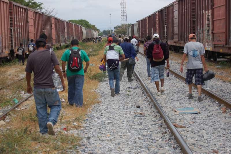 Central American migrants and asylum-seekers prepare to board the freight train in Oaxaca
