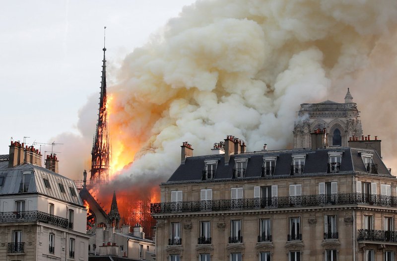 Flames and smoke billow from the Notre Dame Cathedral after a fire broke out in Paris April 15