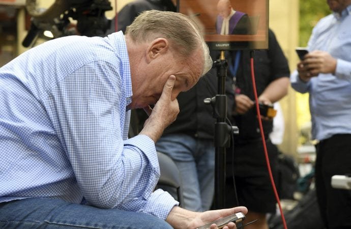 A man reacts outside the County Court during the sentencing of Cardinal George Pell in Melbourne