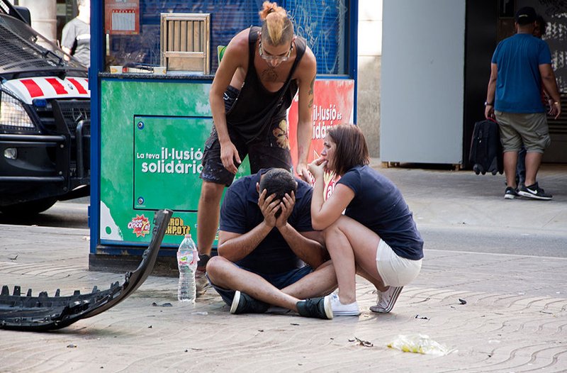 Injured people react after a van crashed into pedestrians in the Las Ramblas district of Barcelona