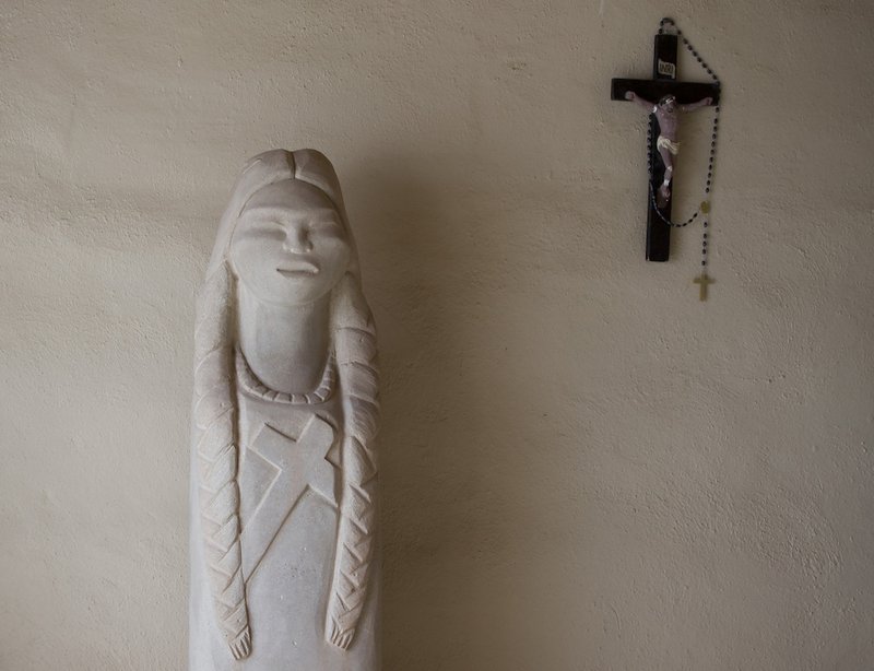 A stone statue of St. Kateri Tekakwitha sits in an alcove of St. Anthony Mission in the Pueblo of Isleta in New Mexico. (CNS photo/Nancy Wiechec)
