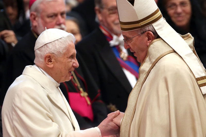 Pope Emeritus Benedict XVI is greeted by Pope Francis at St. Peter’s Basilica in Vatican City in February 2015. (FRANCO ORIGLIA/GETTY IMAGES)