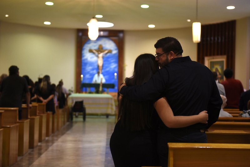 Friends and family attend the funeral Mass of Juan Velazquez at Our Lady of the Light Church in El Paso