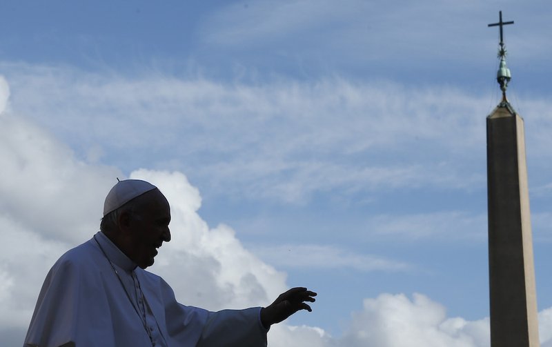 Pope Francis waves as he leaves his general audience in St. Peter's Square at the Vatican Nov. 7. (CNS photo/Paul Haring)