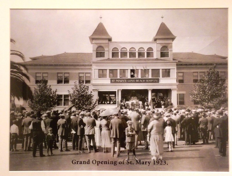 This historical picture illustrates the community’s show of support for the hospital. Look closely and you can see the Sisters in the open window above the crowd. (PHOTO COURTESY ST. MARY MEDICAL CENTER)