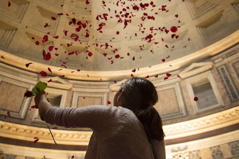 Rose petals shower from the ceiling of the Pantheon
