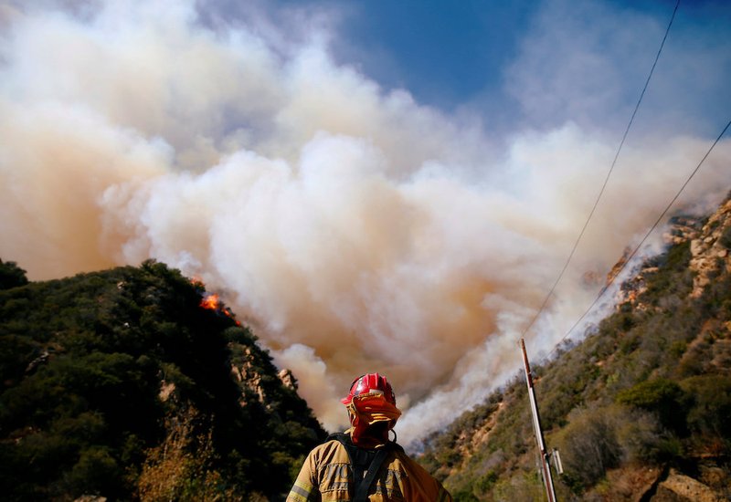 Firefighters battle the Woolsey Fire Nov. 11 in Malibu