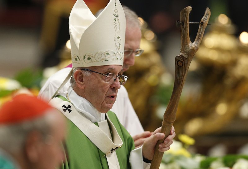 Pope Francis arrives in procession to celebrate the closing Mass of the Synod of Bishops on young people