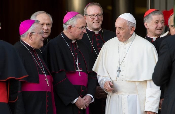 Pope Francis talks with Archbishop Jose H. Gomez of Los Angeles