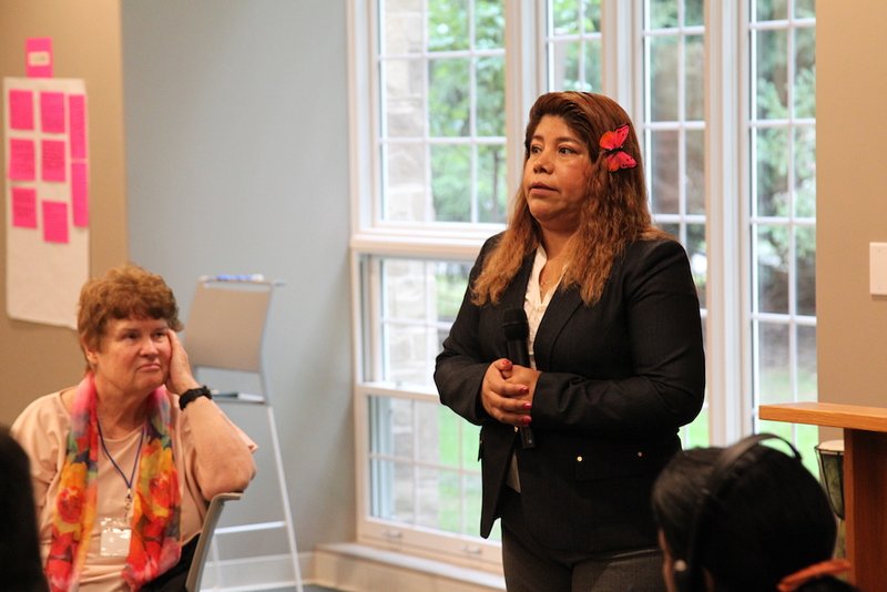 Flor Molina of Los Angeles talks at the Jesuit Retreat Center in Parma