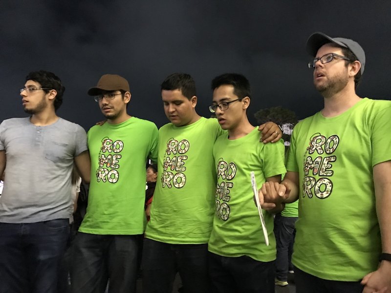 Members of a Marist youth group pray at an Oct. 13 Mass in San Salvador
