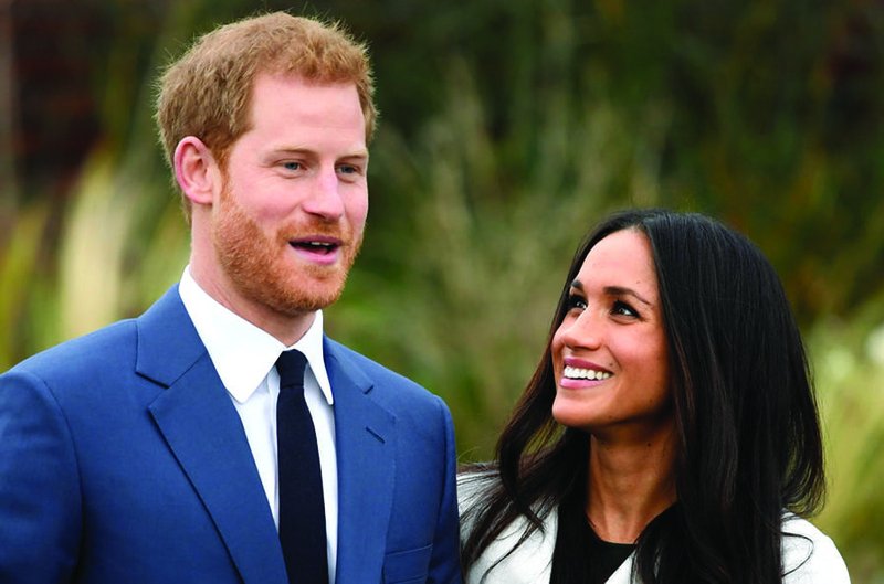 Britain’s Prince Harry poses with Meghan Markle Nov. 27 in the Sunken Garden of Kensington Palace in London after announcing their engagement. Markle attended Immaculate Heart High School in Los Angeles. 