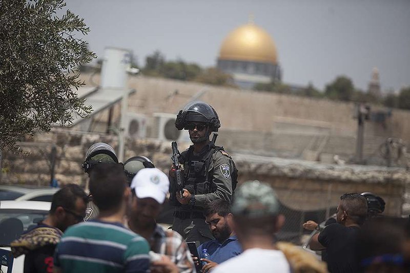 An Israeli border police officer is seen during a Friday pray in Ras el Amud Area outside the Old City on July 21