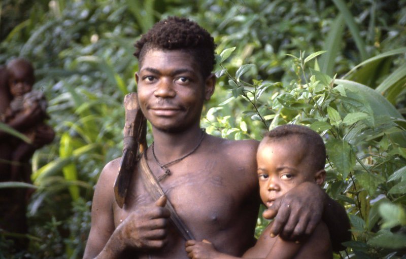 Aka father carrying his daughter while out on a hunt [Credit: Barry Hewlett/The Atlantic]