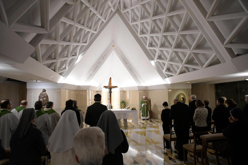 Pope Francis delivers the homily as he celebrates morning Mass in the chapel of his residence