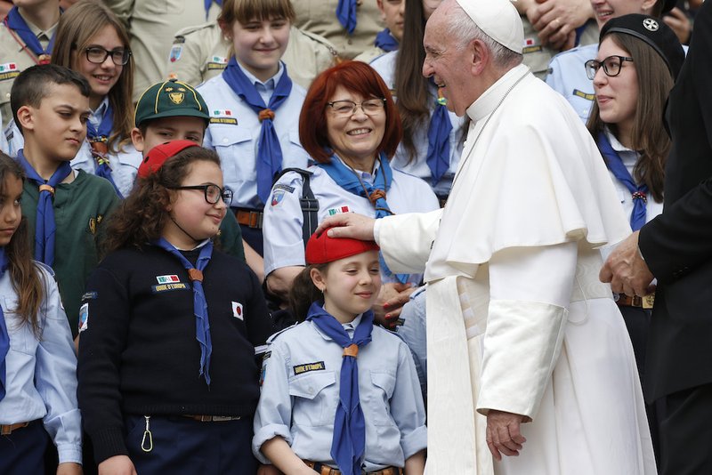 Pope Francis greets Scouts during his general audience in St. Peter's Square at the Vatican May 1