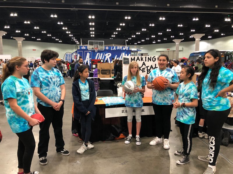 St. Euphrasia's team demonstrates their homemade basketball.