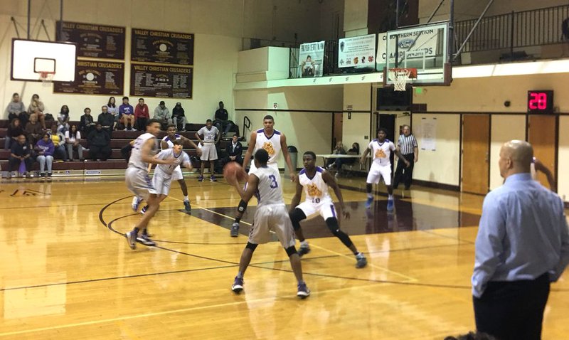 St. Anthony Saints boys basketball team in recent action against Lynwood in the Valley Christian Tournament (photo courtesy @StAnthonySAINTS)