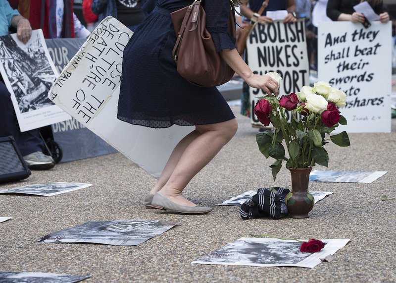 Peace activists hold a Catholic prayer service of repentance near the White House Aug. 9