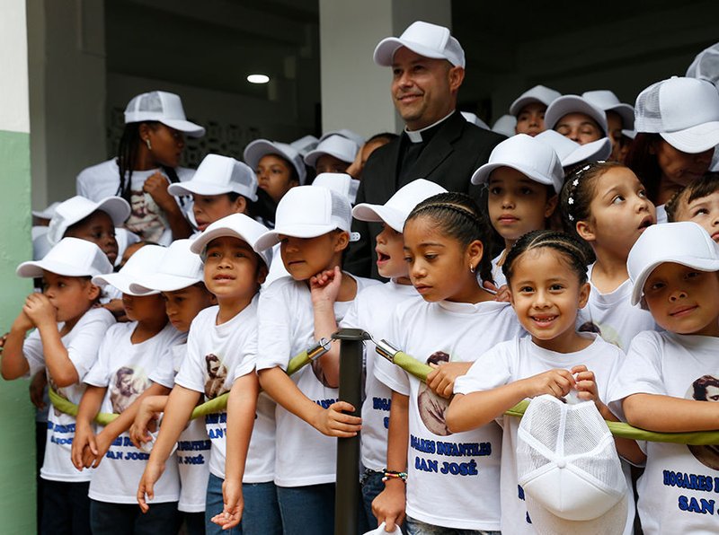 Children at Hogar San Jose children√ïs home wait for Pope Francis in Medellin