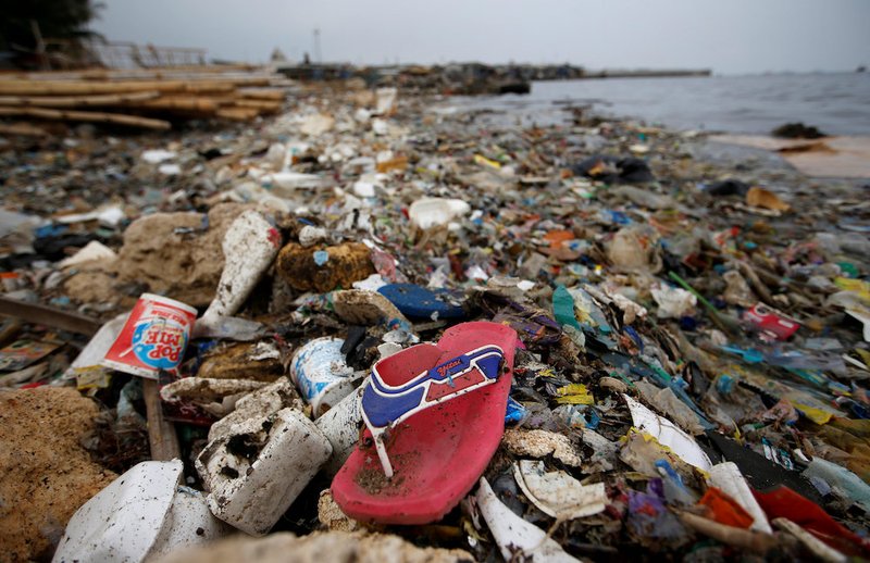 Plastic and styrofoam garbage litters the shoreline in 2018 in Jakarta