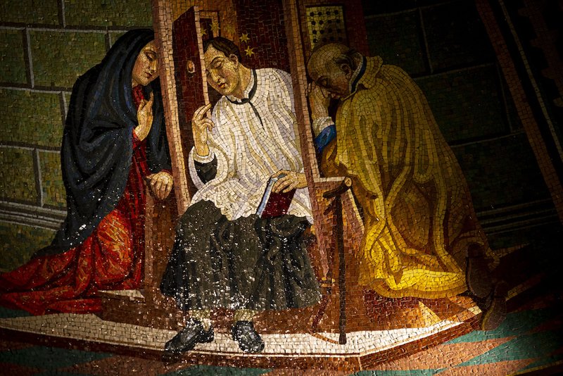 A mosaic image of St. John Nepomucene hearing confessions is displayed inside St. John Nepomucene Catholic Church in New York City May 2