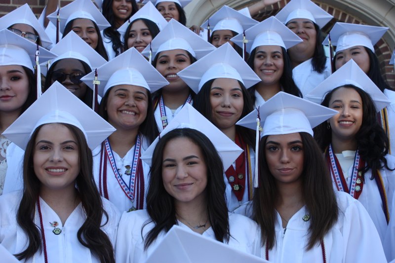 Members of Bishop Conaty-Our Lady of Loretto High School’s graduating class pose in their caps and gowns following their ceremony. On May 25