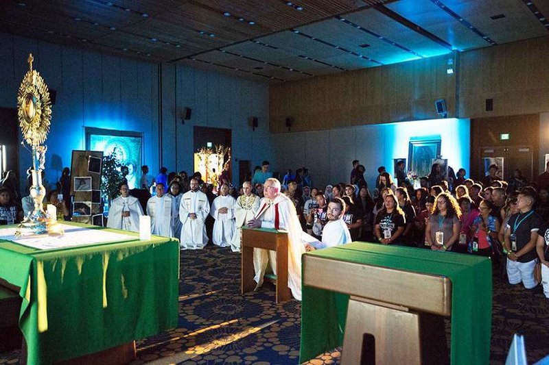 Archbishop Jose Gomez of Los Angeles leads Eucharistic adoration at the City of Saints conference
