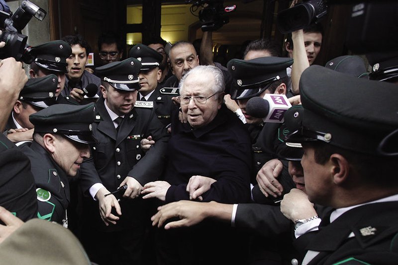 Chilean Father Fernando Karadima leaves after attending a 2015 hearing at the Supreme Court building in Santiago. (CNS photo/Sebastian Silva