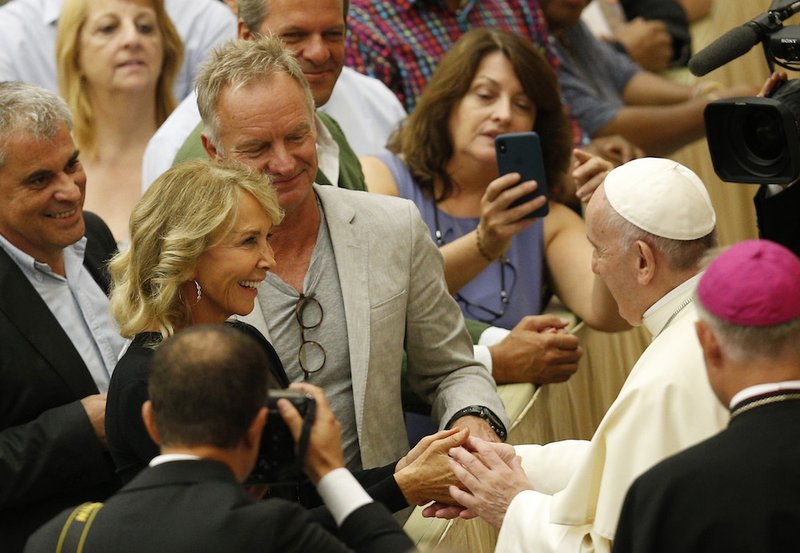 Pope Francis greets English singer Sting