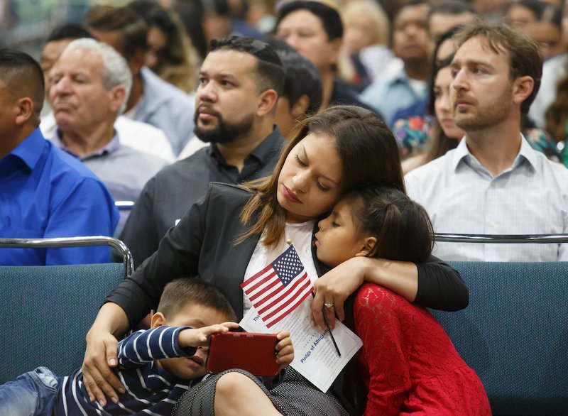 Immigrants are seen Aug. 24 during a naturalization ceremony in Los Angeles. A Trump administration proposal to deny green cards to legal immigrants using public assistance "will dramatically change the process of legal migration and make it increasingly difficult for low-income and working-class individuals to legally migrate to the United States." (CNS photo/Eugene Garcia