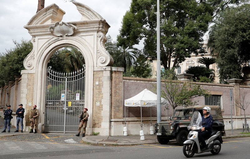 Italian Army and police officers stand in front of the apostolic nunciature to Italy in Rome where workers discovered human bones during a reconstruction project. (CATHOLIC NEWS SERVICE PHOTO/STEFANO RELLANDINI