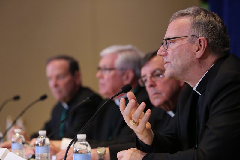 Los Angeles Auxiliary Bishop Robert E. Barron responds to a reporter's question during a news conference at the spring general assembly of the U.S. Conference of Catholic Bishops in Baltimore June 12