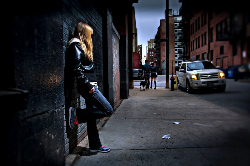 This photo illustration of a young woman depicts the effects of human trafficking. (CNS illustration/Lisa Johnston