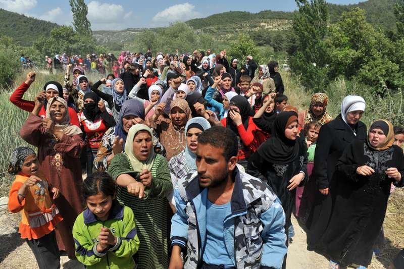 Syrian refugees on the Syria/Turkey border. Credit: thomas koch/Shutterstock