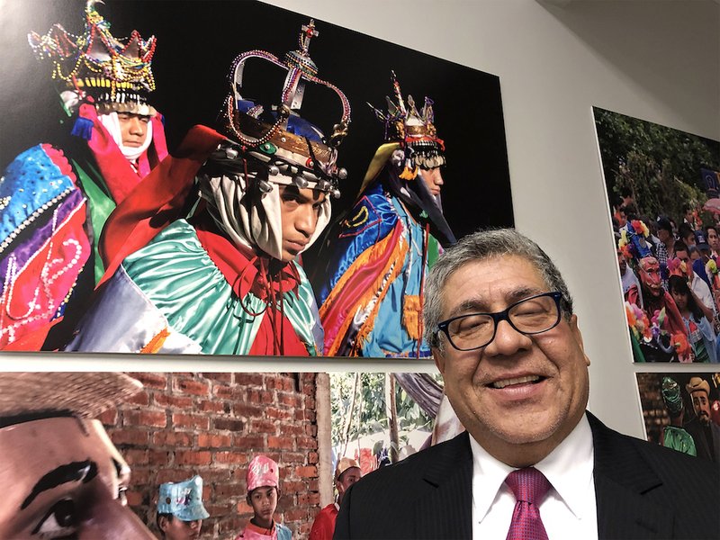 Miguel Servellon attends the Nov. 30 reception opening of the exhibit "El Salvador: Traditions and Identity" at the Embassy of El Salvador in Washington displaying his colorful photographs of indigenous towns and cities in the Central American nation. Servellon