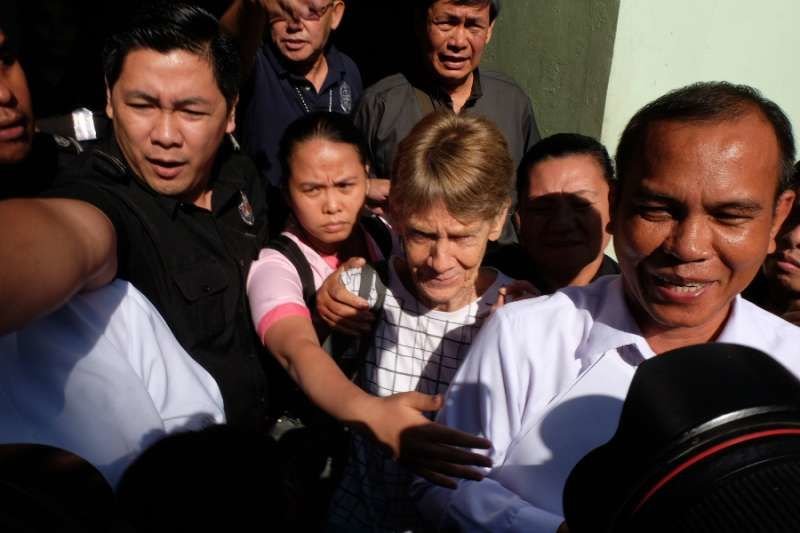 Sr. Patricia Fox walks free from the Bureau of Immigration office in Manila where she was held April 17
