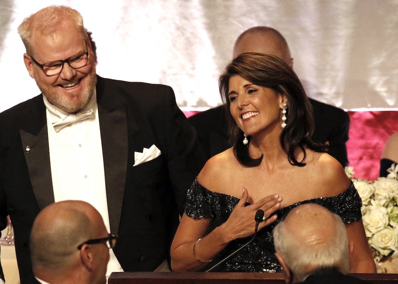 U.S. Ambassador to the United Nations Nikki Haley smiles after being introduced by comedian and master of ceremonies Jim Gaffigan