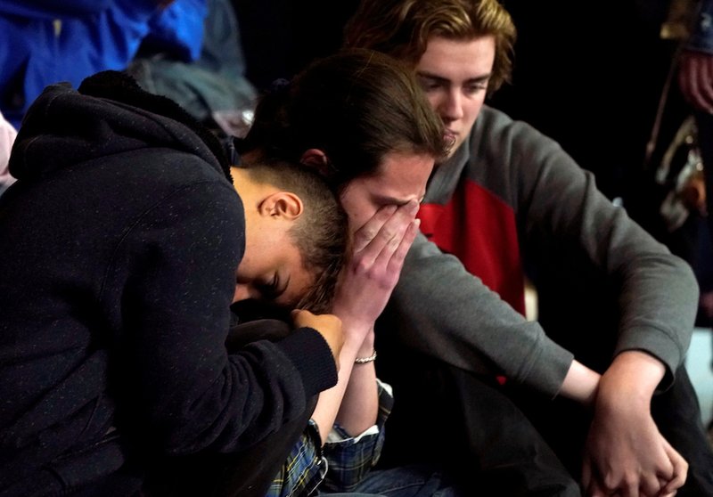 Students mourn during a vigil May 8
