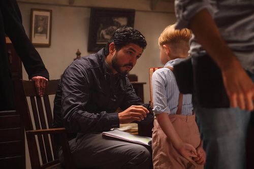 Director Alejandro Monteverde speaks with Jakob Salvati on the set of the movie Little Boy. Courtesy Metanoia Films.