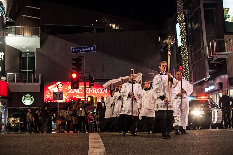 Seminarian David Allen leads a procession through the streets of Hollywood the evening of Nov. 18. (photo/ALEXANDRA COOPER)