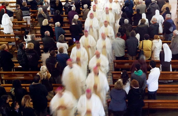 French bishops leave the Basilica of the Rosary in Lourdes after a 2016 Mass during the French bishops' conference. Pope Francis encouraged bishops in France to be determined in their fight against child abuse and implement "zero tolerance" against known abusers. (CNS via Crux)
