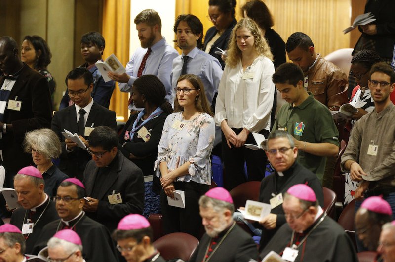 Bishops and observers attend a session of the Synod of Bishops on young people