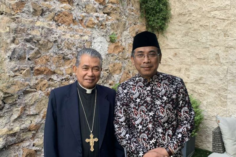 Sheikh Yahya Cholil Staquf with Archbishop Agustinus Agus of Pontianak. (Courtney Grogan/CNA)