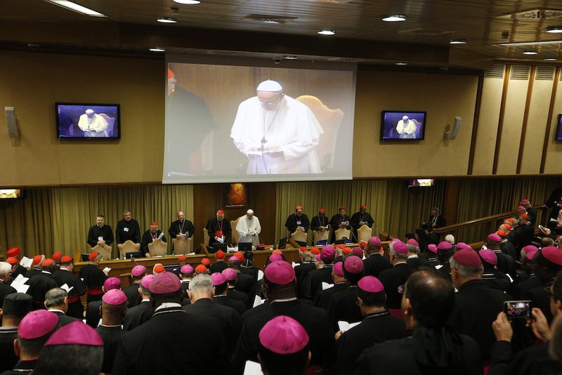 Pope Francis prays at the opening session of the Synod of Bishops on young people